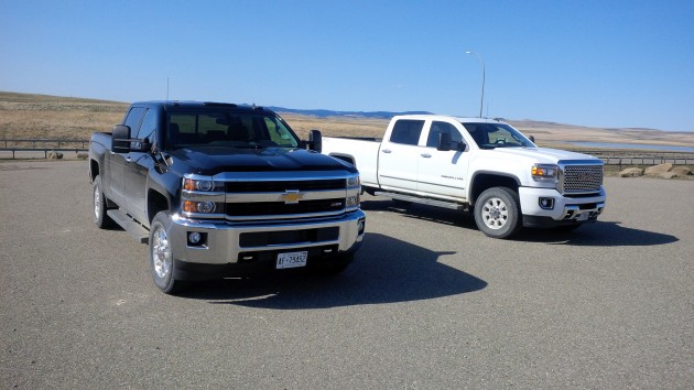 The GMC Sierra HD (left) pictured with its sibling the Chevy Silverado HD.