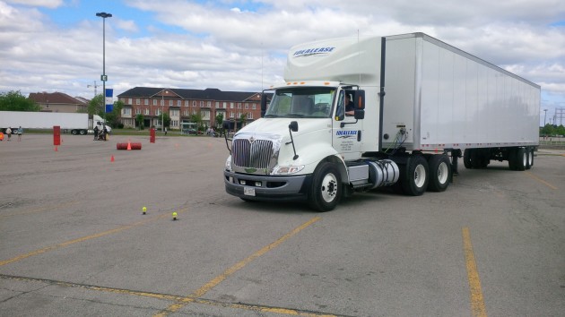 A driver in the tandem-tandem category attempts one of the trickier challenges, placing the wheels between a set of closely placed tennis balls.