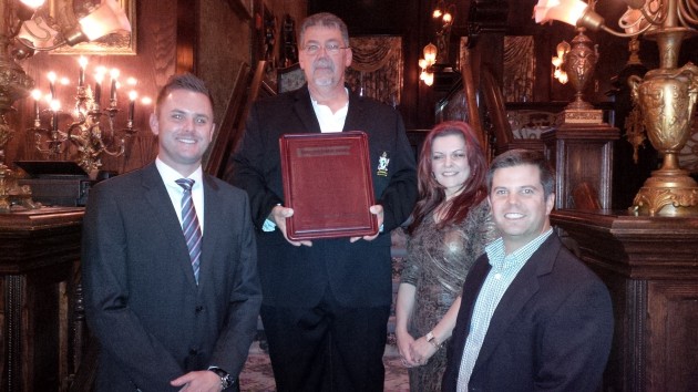 Sponsors Ryan Weary, Castrol (L-R), Danijela Franco, Mack Trucks and Brad Houle, Goodyear, congratulate Sutherland.