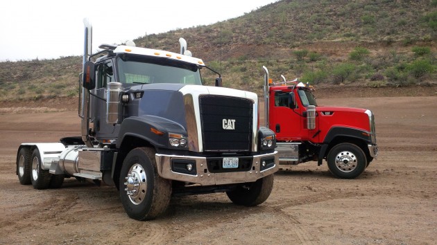 A pair of Cat CT680s in the Arizona desert at Cat's TInaja Hills proving grounds.