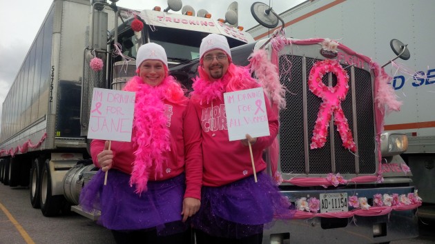 Ken Layton (right) and wife Melissa Layton deck out their truck (and themselves) for the convoy.