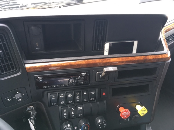 A groove along the dash is useful for storing small items and the air brake releases were relocated to the right.