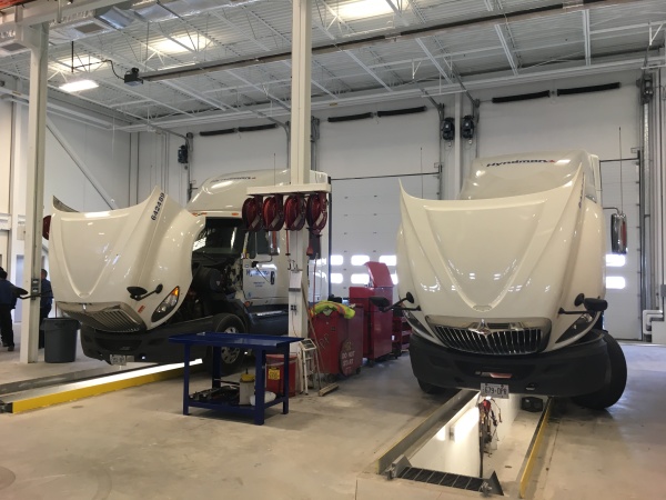 The six-bay shop features a truck wash and loading dock.